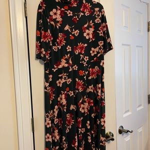 Midi length, a-line turtleneck short sleeve dress with floral design